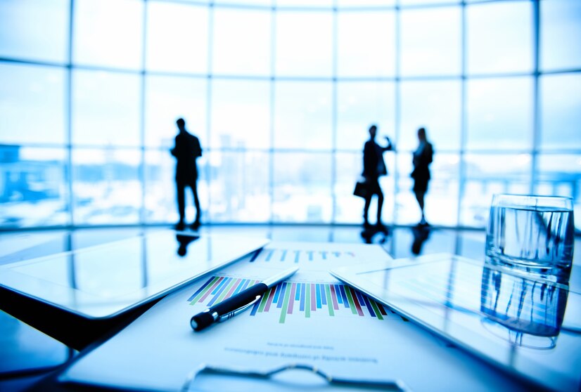 close-up-tablet-documents-desk_1098-2535